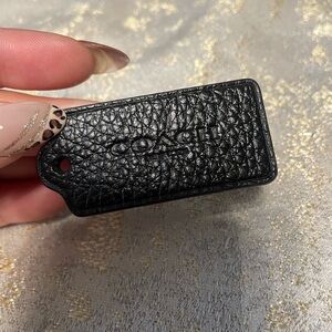 Coach Textured Black Leather tag